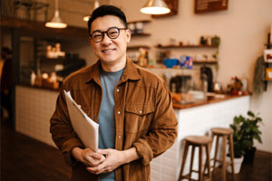 A landlord standing in a shop